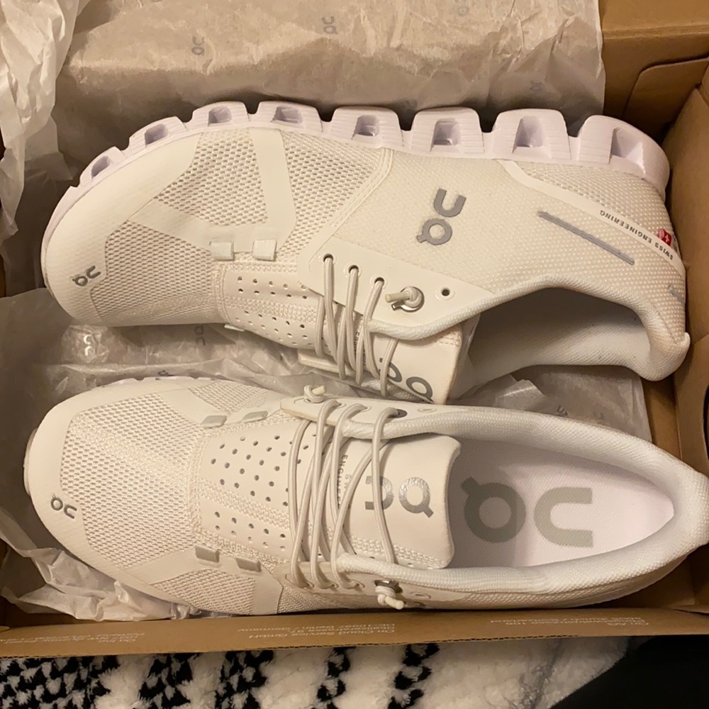 On cloud running shoes. Never worn outside. Stain on right shoe